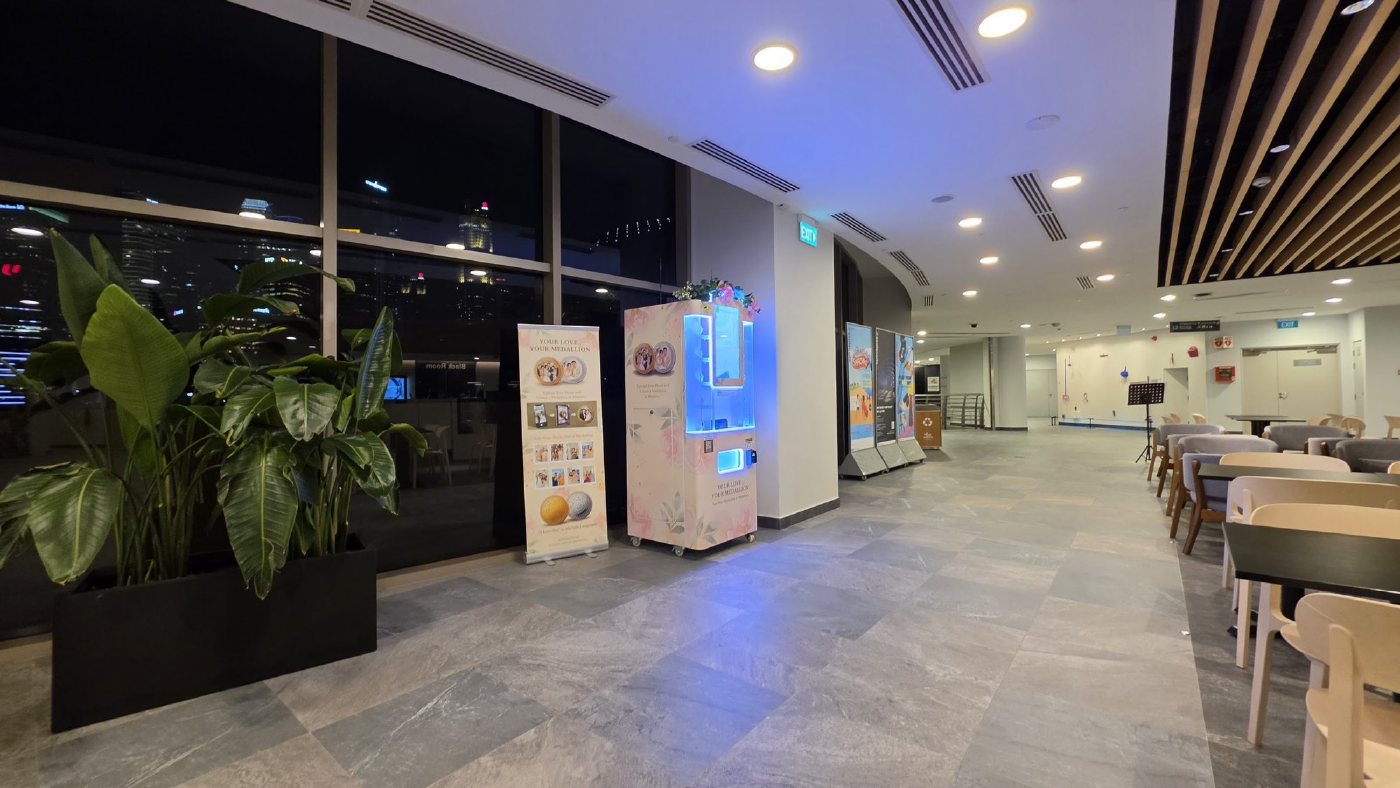 Wide view of the DIY Medallion machine from the Esplanade Mall seating area